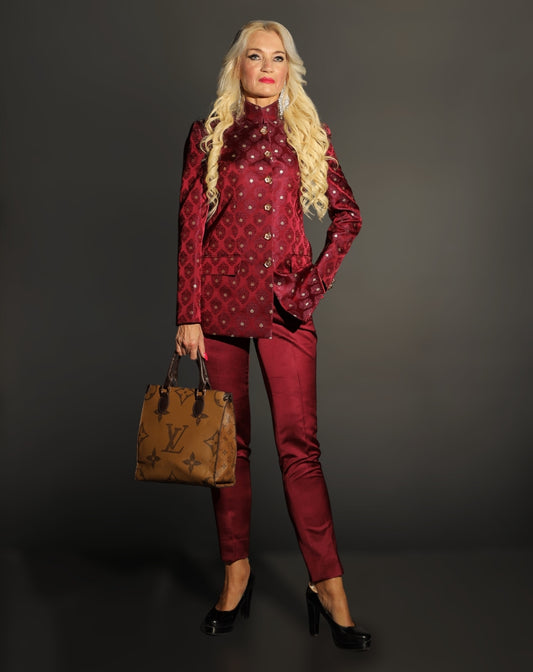 Woman in a red outfit holding a brown handbag