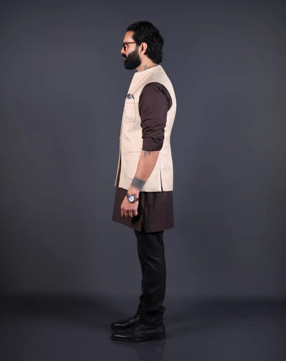 Model wearing a stylish jacquard patterned Nehru jacket for men over a brown kurta.