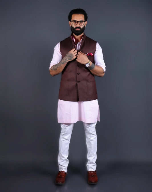 Model wearing a brown textured Nehru jacket with a pink kurta