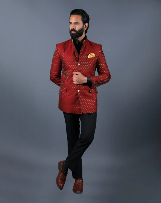 Front view of model standing in a Deep red woven Jacquard Bandhgala suit.