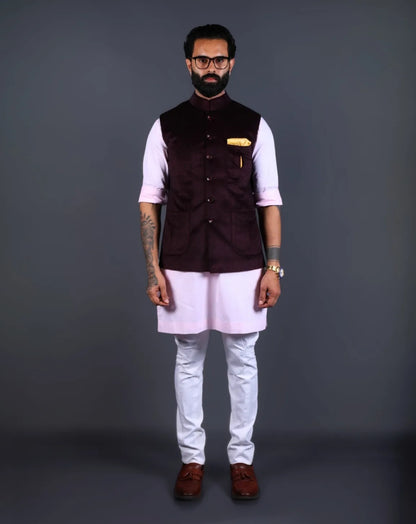 Man wearing a wine velvet Nehru jacket with golden pocket square