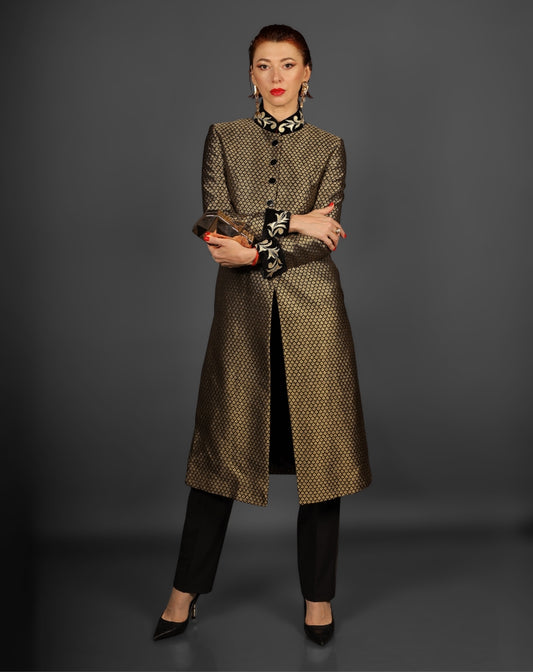 Full-length view of a formal women's sherwani paired with black trousers.